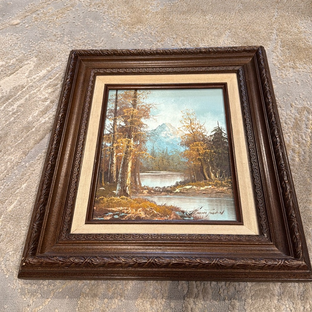 oil painting by Guirio Tman, depicting a landscape scene with mountain and lake